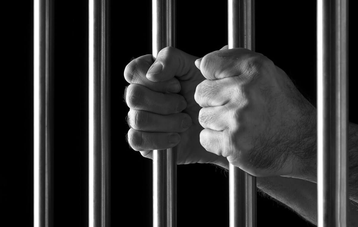 Prisoner Holds Cell bars